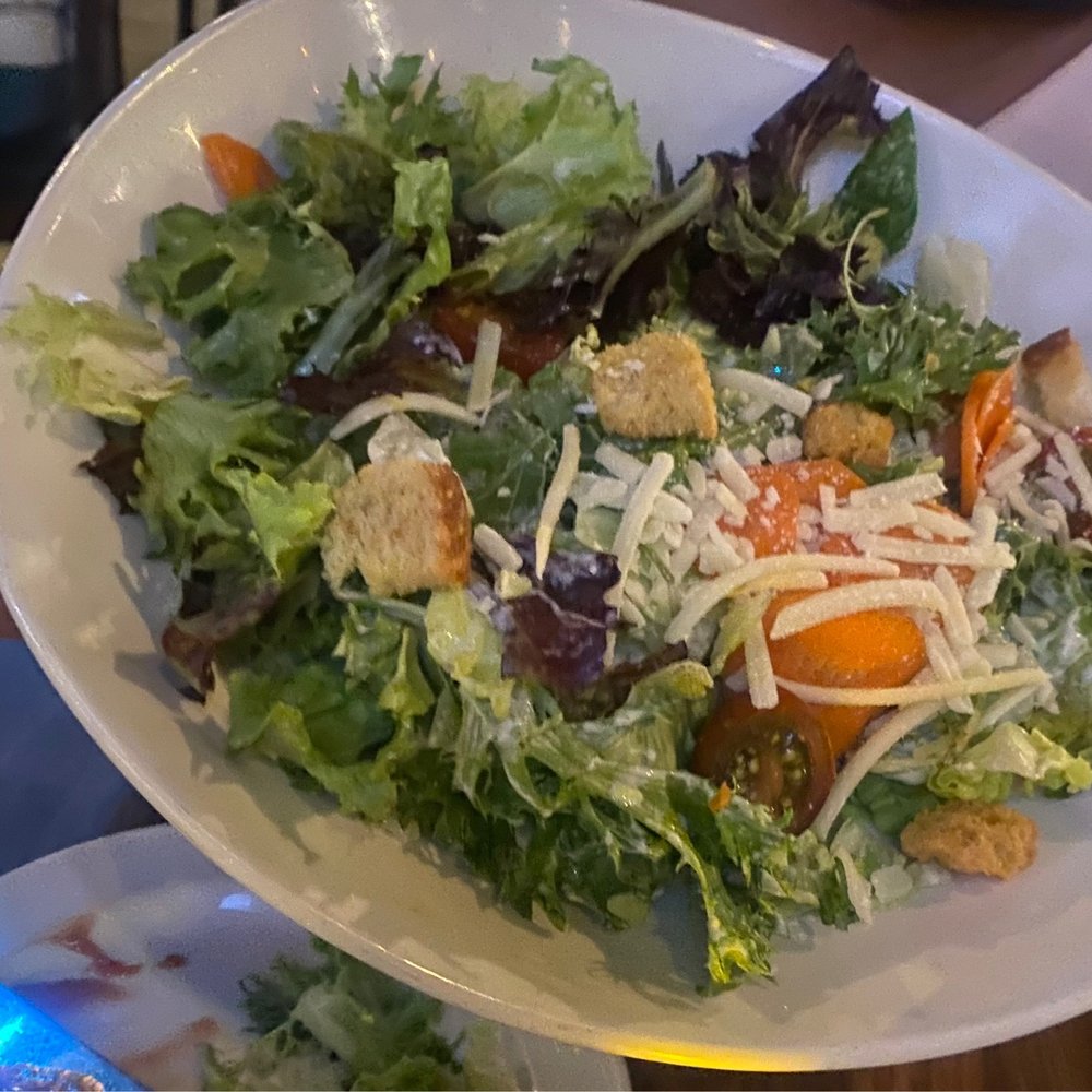 Yard House - My friend orders the Caesar's salad. - New American Near Me - Denver, Colorado Yard House - My friend orders the Caesar's salad. - New American Near Me - Denver, Colorado