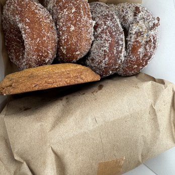 Weltons Tiny Bakeshop - Apple cider donuts, a cookie, and a wrapped sesame loaf - Bakeries Near Me - Charleston, South Carolina Weltons Tiny Bakeshop - Apple cider donuts, a cookie, and a wrapped sesame loaf - Bakeries Near Me - Charleston, South Carolina