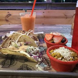 Redfish grilled tacos. It needed a bigger piece of fish. Street corn did not have much flavor. Strawberry margarita! Redfish grilled tacos. It needed a bigger piece of fish. Street corn did not have much flavor. Strawberry margarita!