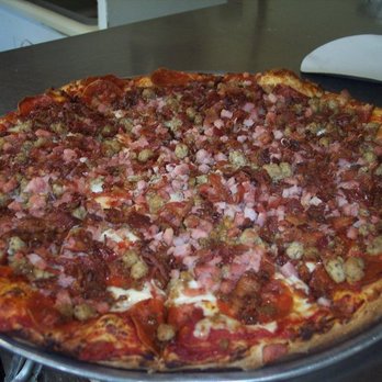 Block City Pizza - a large pizza on a table - Pizza Near Me - McKenzie, Tennessee Block City Pizza - a large pizza on a table - Pizza Near Me - McKenzie, Tennessee
