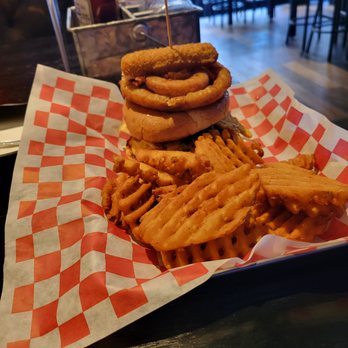 Sweet Spot - a stack of onion rings and a burger - Sports Bars Near Me - Astoria, New York Sweet Spot - a stack of onion rings and a burger - Sports Bars Near Me - Astoria, New York