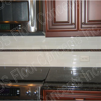 JDS Floor Concepts, Inc - a kitchen with a stove, microwave, and cabinets - Flooring Near Me - Naples, Florida