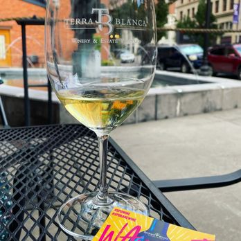 Terra Blanca Spokane - a glass of wine on a table - Wine Tasting Room Near Me - Spokane, Washington Terra Blanca Spokane - a glass of wine on a table - Wine Tasting Room Near Me - Spokane, Washington