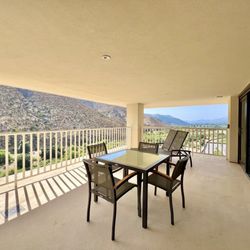 Harrah's Resort Southern California - Oh So Suite balcony. It's has a table with chairs and two lounge chairs. It's one of the biggest balconies I've seen at any hotel.