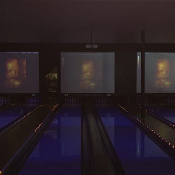 Lucky Strike Orange - DVD playing the ultrasound on 3 TV screens - Bowling Near Me - Orange, California