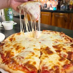 Wick City Saloon - 8-cut cheese pizza from Wick City Saloon, Kittanning PA. Hot and cheesy. Nice for a bar pizza!