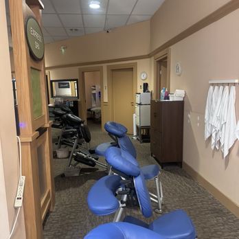 Express Day Spa - The entrance of the spa, with chairs and private rooms along each side. - Day Spas Near Me - Concord, North Carolina Express Day Spa - The entrance of the spa, with chairs and private rooms along each side. - Day Spas Near Me - Concord, North Carolina