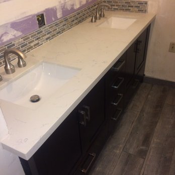 St Clair Tile and Stone - White quartz double vanity with glass backsplash. - General Contractors Near Me - Bakersfield, California St Clair Tile and Stone - White quartz double vanity with glass backsplash. - General Contractors Near Me - Bakersfield, California