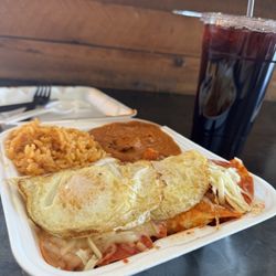 Mr Toro Carniceria - Chilaquiles, red with eggs over easy, so delicious