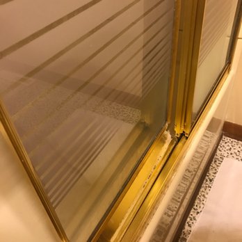 Bryant Real Estate - Broken shower door - Vacation Rentals Near Me - Carolina Beach, North Carolina