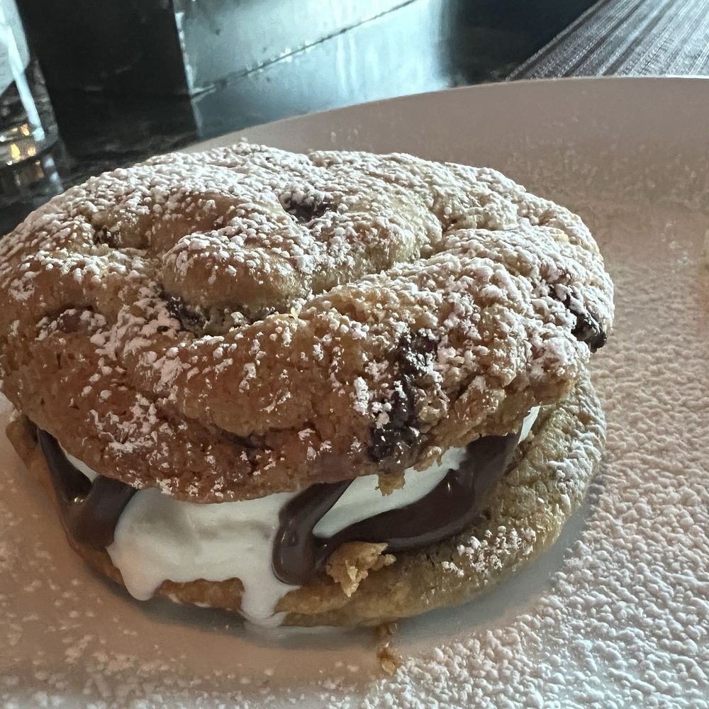 The Halston - Chocolate Chip Cookies stuffed with Vanilla Ice Cream and Nutella (off menu item) - American Near Me - Melville, New York The Halston - Chocolate Chip Cookies stuffed with Vanilla Ice Cream and Nutella (off menu item) - American Near Me - Melville, New York