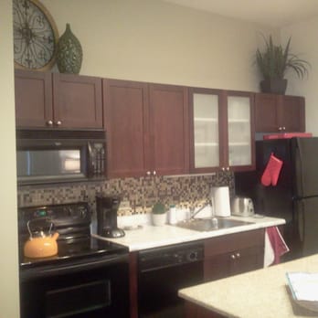 Excellence Eco Painting - Gerardo fixed the crooked seam between the red wall and the ceiling and finished the hard-to-reach area above the counters. - Painters Near Me