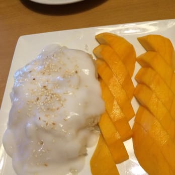 Seven Seas - Sticky rice with mango. Warm with a strip of hard rice on one side. That is not donut glaze on top. But almost. - Thai Near Me - Corona, California Seven Seas - Sticky rice with mango. Warm with a strip of hard rice on one side. That is not donut glaze on top. But almost. - Thai Near Me - Corona, California