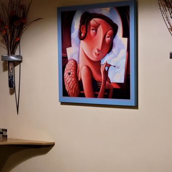Hank's Cheesecakes - a painting of a woman in a hat - Bakeries Near Me - Saint Louis, Missouri