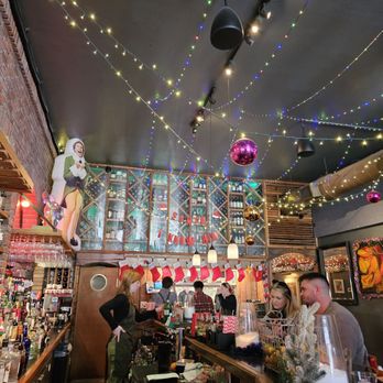 Forgotten Tonic - Christmas decor across the bar - Wine Bars Near Me - Saint Augustine, Florida Forgotten Tonic - Christmas decor across the bar - Wine Bars Near Me - Saint Augustine, Florida