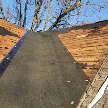 Mack Builders - the roof of a home with a new shingled roof - Handyman Near Me