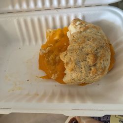 Rhino Coffee - Downtown - Homemade buttermilk biscuit with extra cheddar cheese.   A piece broke off when I moved it, it didn't come like that.