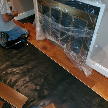 Get Laid Flooring - a man sitting on a chair - Flooring Near Me Get Laid Flooring - a man sitting on a chair - Flooring Near Me