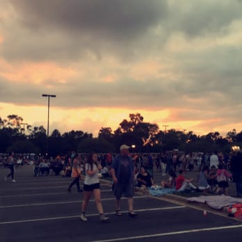 Itasca's Fantastic Fireworks - Sun setting over Hamilton Lakes grounds/parking lot - Festivals Near Me - Itasca, Illinois