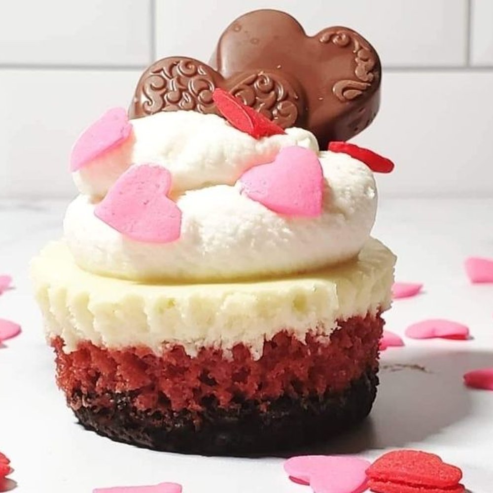 Sweet Mims - a red velvet cupcake with white frosting and pink and red hearts - Desserts Near Me Sweet Mims - a red velvet cupcake with white frosting and pink and red hearts - Desserts Near Me