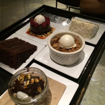 Cafe Flora - This is the dessert menu you order from. The bottom left, the brownie sundae was to die for. We also ordered the coconut almond cake. - Vegetarian Near Me - Seattle, Washington Cafe Flora - This is the dessert menu you order from. The bottom left, the brownie sundae was to die for. We also ordered the coconut almond cake. - Vegetarian Near Me - Seattle, Washington