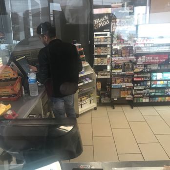 7-Eleven - a man at a cash register in a grocery store - Convenience Stores Near Me - Garland, Texas 7-Eleven - a man at a cash register in a grocery store - Convenience Stores Near Me - Garland, Texas