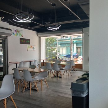 Refocused Vegan - a dining area with tables and chairs - Vegan Near Me - Baltimore, Maryland