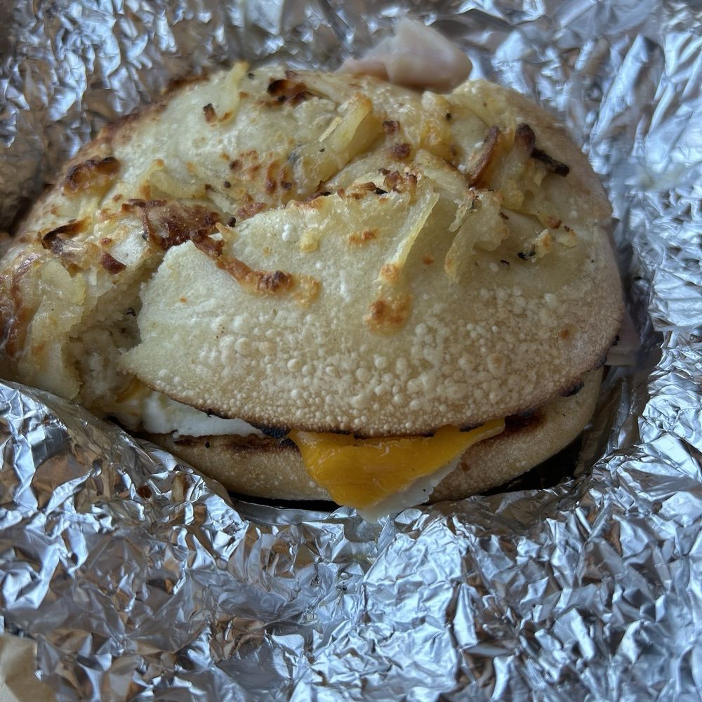 Einstein Bros. Bagels - Close up of farmhouse breakfast sandwich on hash brown bagel - Bagels Near Me - Fresno, California Einstein Bros. Bagels - Close up of farmhouse breakfast sandwich on hash brown bagel - Bagels Near Me - Fresno, California