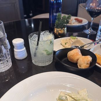 Fogo de Chão - Caipirinha and the $7.50 bottle of water we somehow acquired rather than filling our glasses from the pitchers of ice water we could see... - Brazilian Near Me - Columbus, Ohio