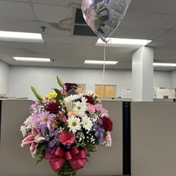 Expressions of Love Flowers & Gifts - Mother's Day flowers (their large version/price point) and birthday balloon.