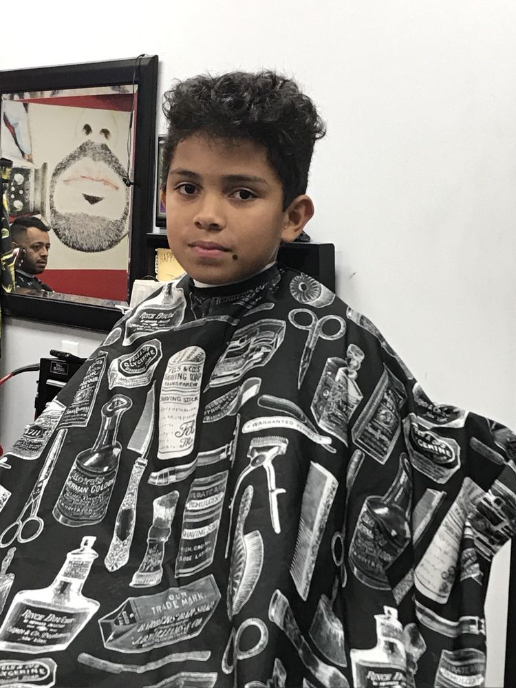 Exclusive Cuts Barbershop Logo