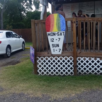 Willis Sno-Cone Shop - a rainbow sign on the porch - Shaved Ice Near Me - Willis, Texas
