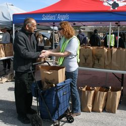 Veteran at a Soldiers' Angels Food Distribution receives groceries.