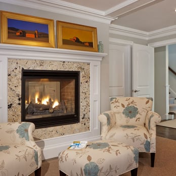 The Backyard Collaborative - a living room with a fireplace - General Contractors Near Me - Billerica, Massachusetts The Backyard Collaborative - a living room with a fireplace - General Contractors Near Me - Billerica, Massachusetts
