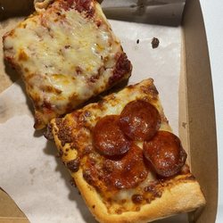Larry's Pizza & Sports Parlor - Single Cheese Slice A Slice of Pepperoni Pizza