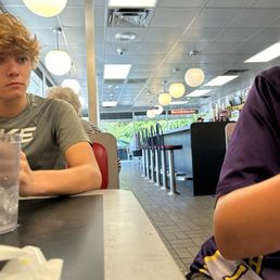 This is me and my friends sucking on lollipops that the waitress gave us This is me and my friends sucking on lollipops that the waitress gave us