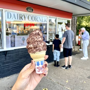 Dairy Corner - a hand holding a cone of ice cream - Ice Cream & Frozen Yogurt Near Me - Cincinnati, Ohio