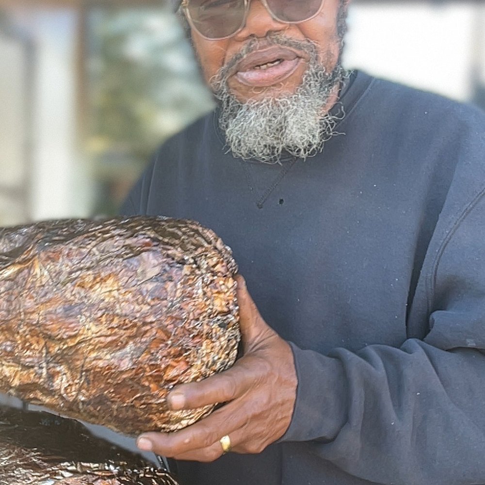 Fire For The Lord Bbq - a man with a beard and a beardless face holding a bunch of bread - Barbeque Near Me - Greenville , Texas Fire For The Lord Bbq - a man with a beard and a beardless face holding a bunch of bread - Barbeque Near Me - Greenville , Texas