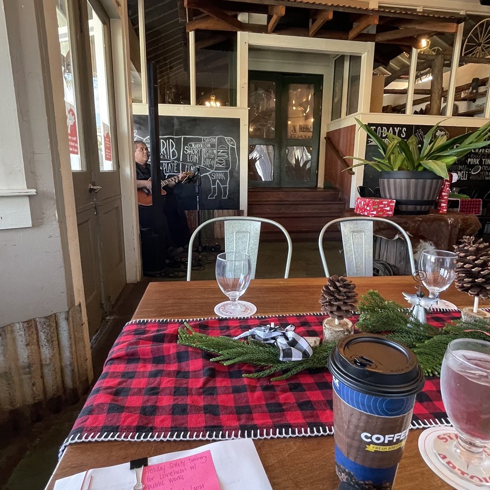 The Saddle Room - a table with a menu and glasses - Dive Bars Near Me - Waimea, Hawaii The Saddle Room - a table with a menu and glasses - Dive Bars Near Me - Waimea, Hawaii