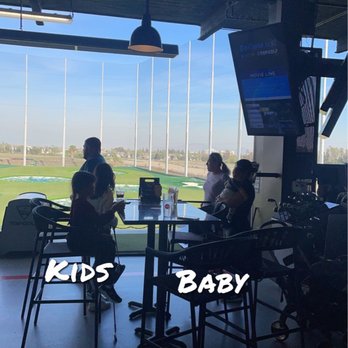 Topgolf - Just one of the many bays filled with kids! - Sports Bars Near Me - Ontario, California Topgolf - Just one of the many bays filled with kids! - Sports Bars Near Me - Ontario, California