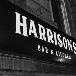 Harrisons Bar & Kitchen - Harrison's sign lighting up Victoria Street.