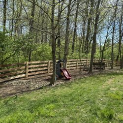 EMM Fencing & More - Right half of Kentucky 4-Board into a 45 degree corner headed up hill.