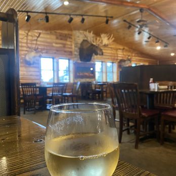 Good Times Restaurant & Bar - Relaxing after a tiring day at work, enjoying a cold glass of chardonnay. - Pizza Near Me - Caledonia, Minnesota