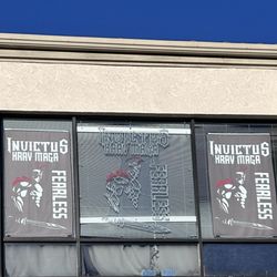 Invictus Krav Maga - Outside: view of studio on the second floor from adjacent ground level parking lot