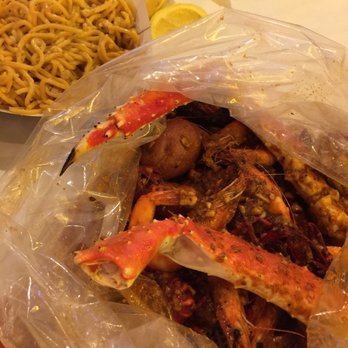 Shell Shock Seafood House - Garlic noodles and basket #2 with house flavor - Seafood Near Me - Hayward, California Shell Shock Seafood House - Garlic noodles and basket #2 with house flavor - Seafood Near Me - Hayward, California