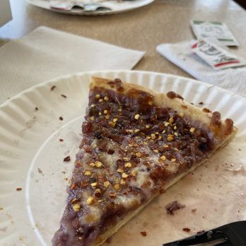 Park Cafe - Slice of huckleberry and bacon pizza with red chili flakes - American Near Me - Saint Mary, Montana Park Cafe - Slice of huckleberry and bacon pizza with red chili flakes - American Near Me - Saint Mary, Montana