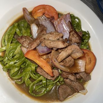 Ceviche 19 - Tallarin Saltado beef - pesto pasta with their delicious beef , red onions, and tomatoes cooked to perfection - Peruvian Near Me - Anaheim, California