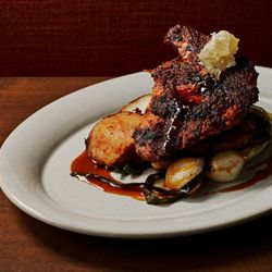 Piri Piri Chicken Coal-roasted potatoes, charred knob onions, heirloom cherry tomato salad, pan jus