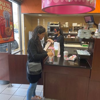 Dunkin' -  a woman at a dunkin'donuts counter - Donuts Near Me - Yonkers, New York
