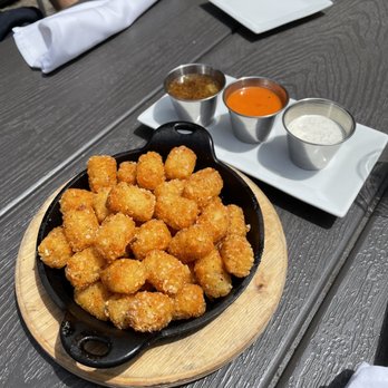 South Kitchen + Bar - Iron Skillet tots with three sauces - Cocktail Bars Near Me - Athens, Georgia South Kitchen + Bar - Iron Skillet tots with three sauces - Cocktail Bars Near Me - Athens, Georgia